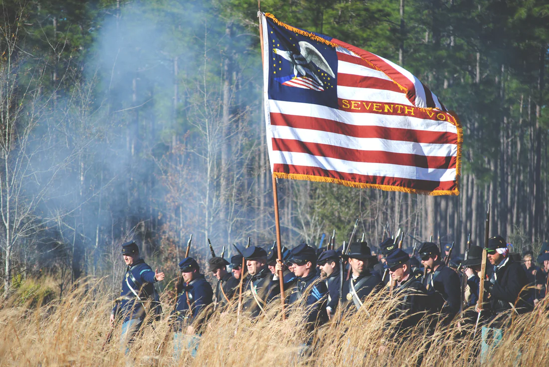 Union reenactors carry the flag at the Battle of Olustee reenactment, 2014.