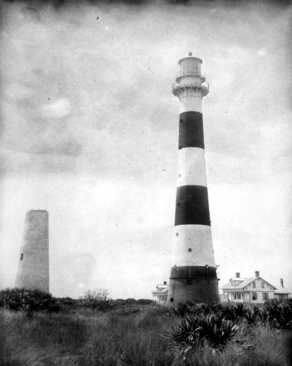 The old brick lighthouse (left) and the iron tower (right) at Cape Canaveral, before the iron tower was moved.