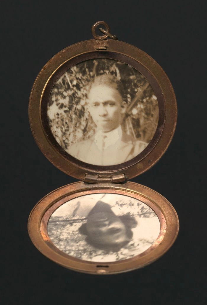 Harriette Moore's locket, with photographs of Harriette and Harry.