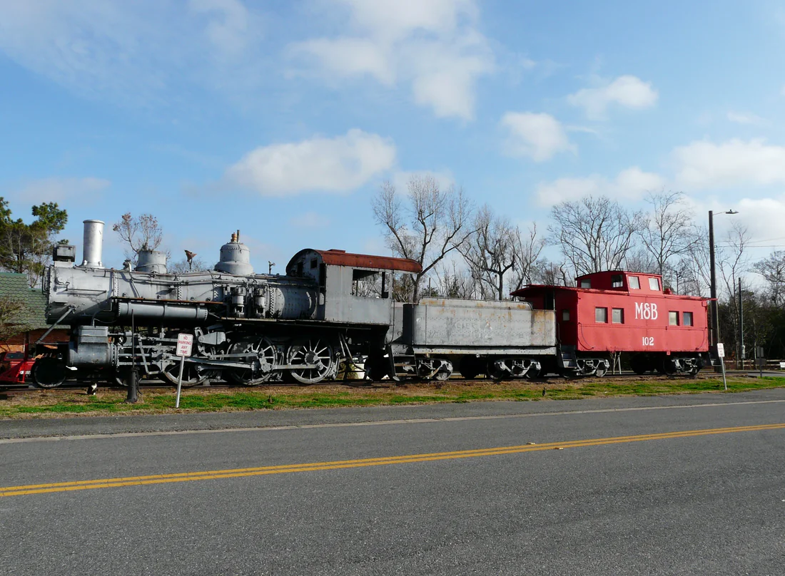 M&B steam locomotive No. 444 and a caboose on display in M&B Park in Blountstown.