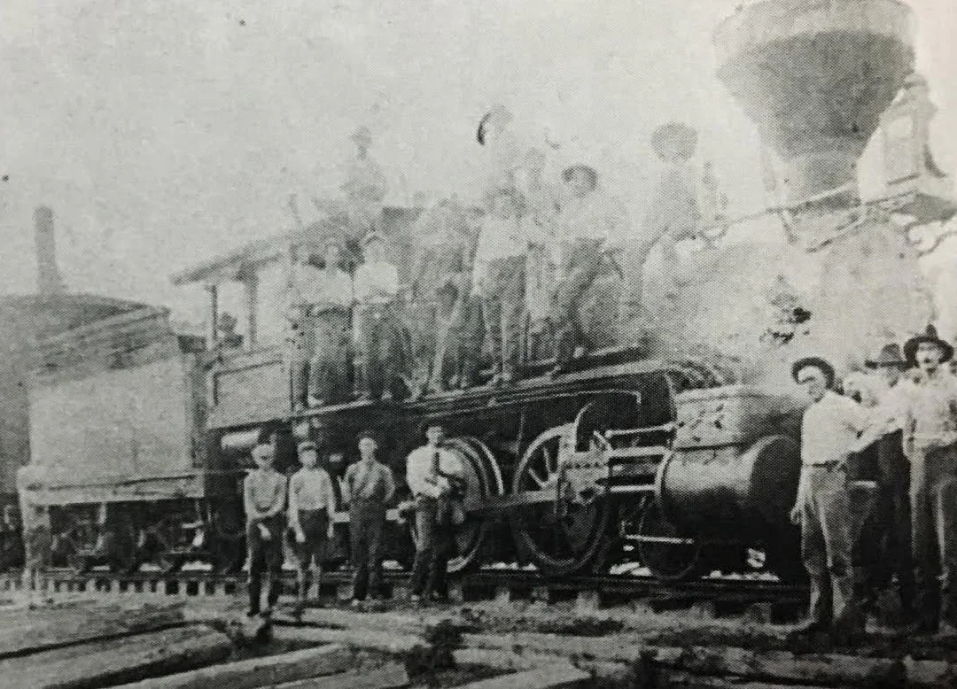 Men posed on a train in Lake City in the early 1900s.