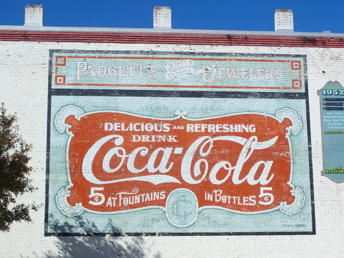 An old painted Coca-Cola sign on a brick wall in the Quincy Historic District, 2011.