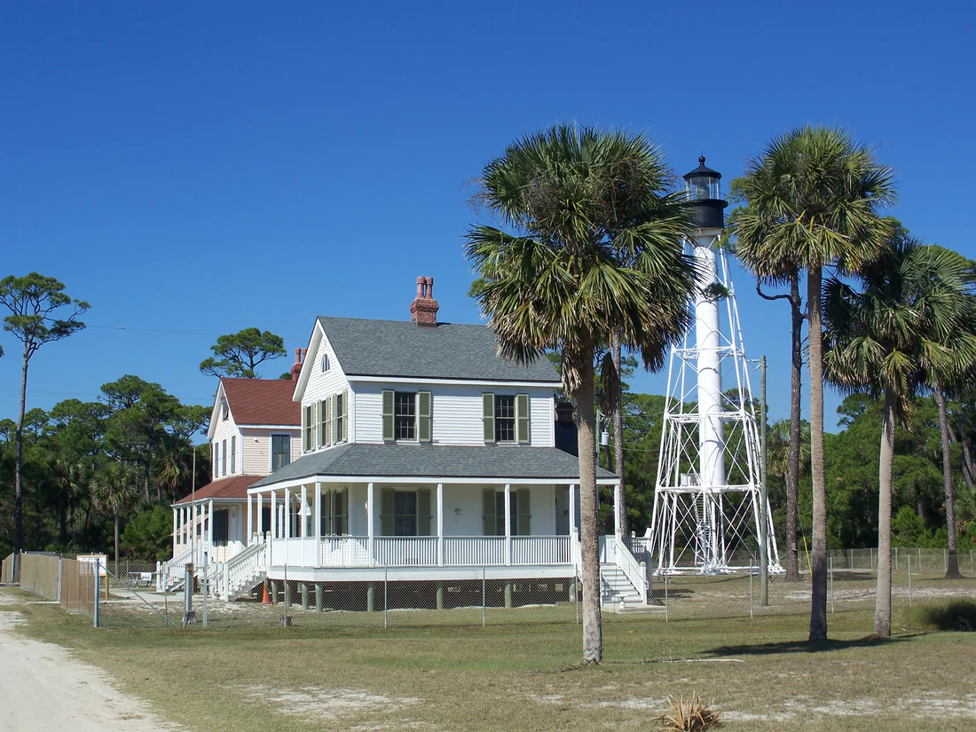 The Cape San Blas Lighthouse and a Coast Guard house on the cape in 2010, before the 2014 move.