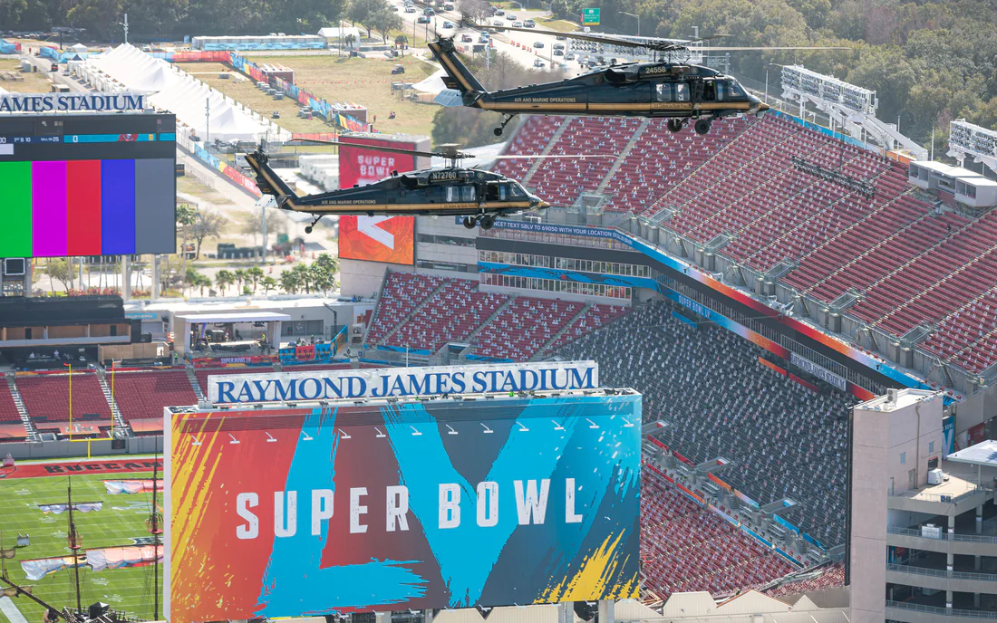 Helicopters fly over Raymond James Stadium in Tampa the week before Super Bowl LV, January 31, 2021.