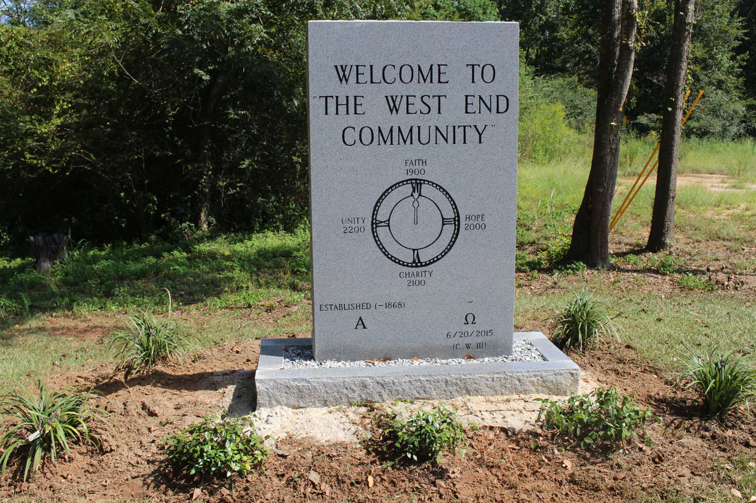 The stone marker welcoming visitors to the West End community in Marianna.