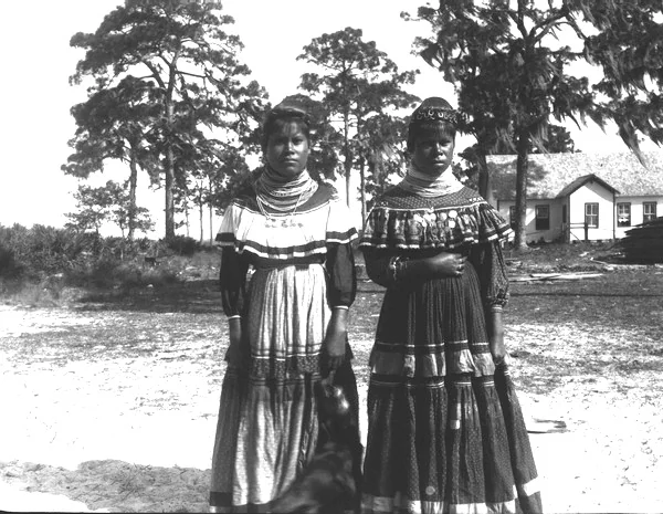 Two Seminole women at Tantie, the early name for Okeechobee, about 1913.