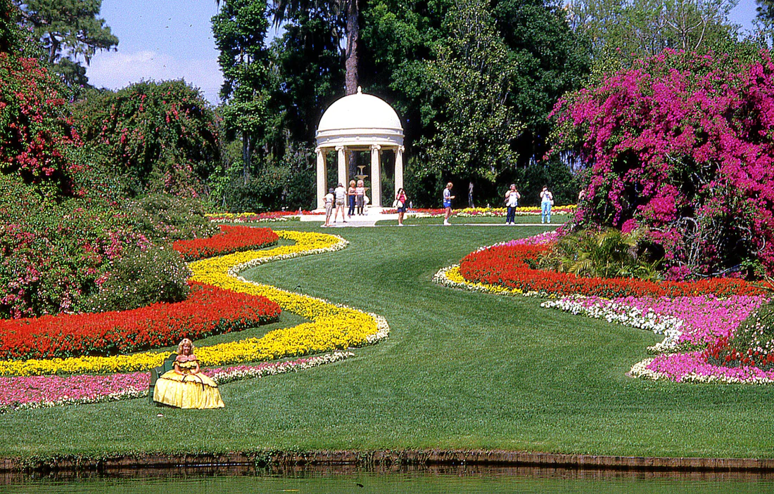 Flower gardens and a Southern belle in a hoop skirt at Cypress Gardens in Winter Haven.