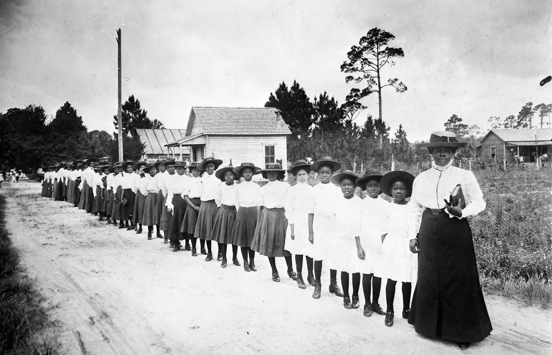 Mary McLeod Bethune with a line of girls from her school, about 1905.