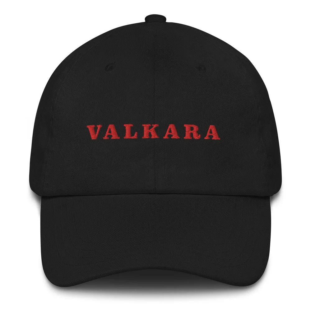 A black cap with the word Valkara embroidered in red across the front